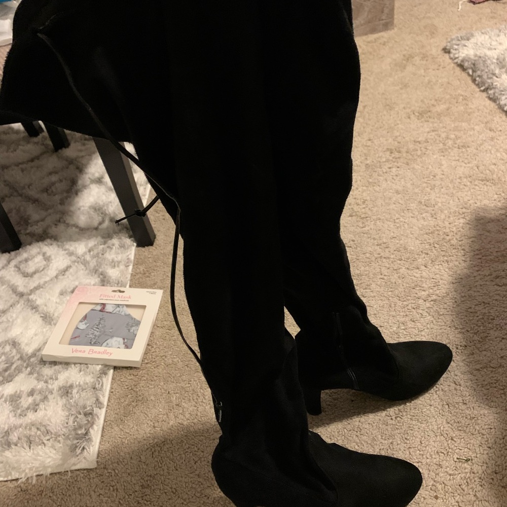 Women’s black thigh high boots